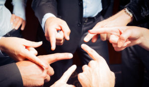 business team pointing and blaming each other | brick water infiltration damage